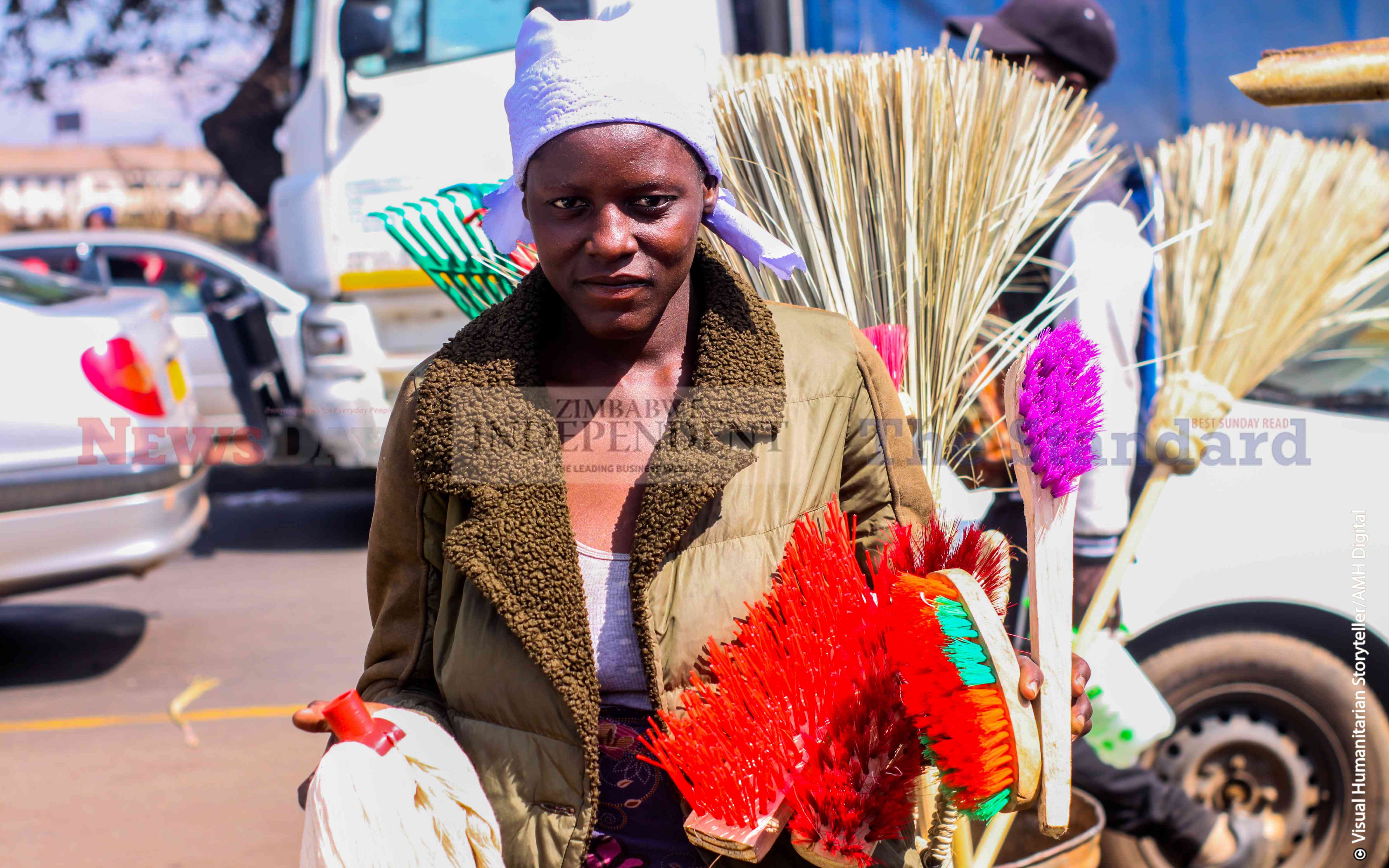 Lyna Mujubheki (22) makes soft and hard brooms for resale.