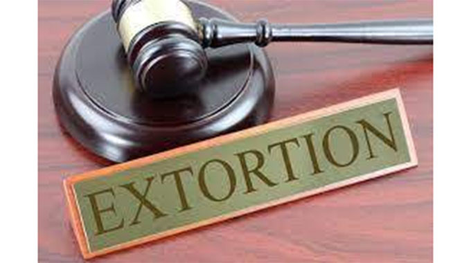 CIO agent convicted of extortion