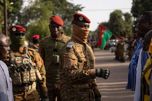 A group of masked soldiers in Burkina Faso roaming in the streets.