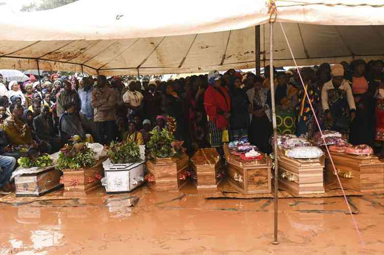 Malawians search for relatives buried under the mud as death toll jumps