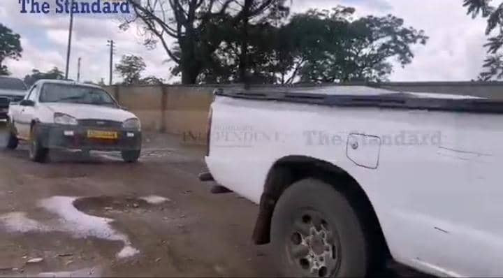 Harare motorists negotiate the city’s treacherous roads
