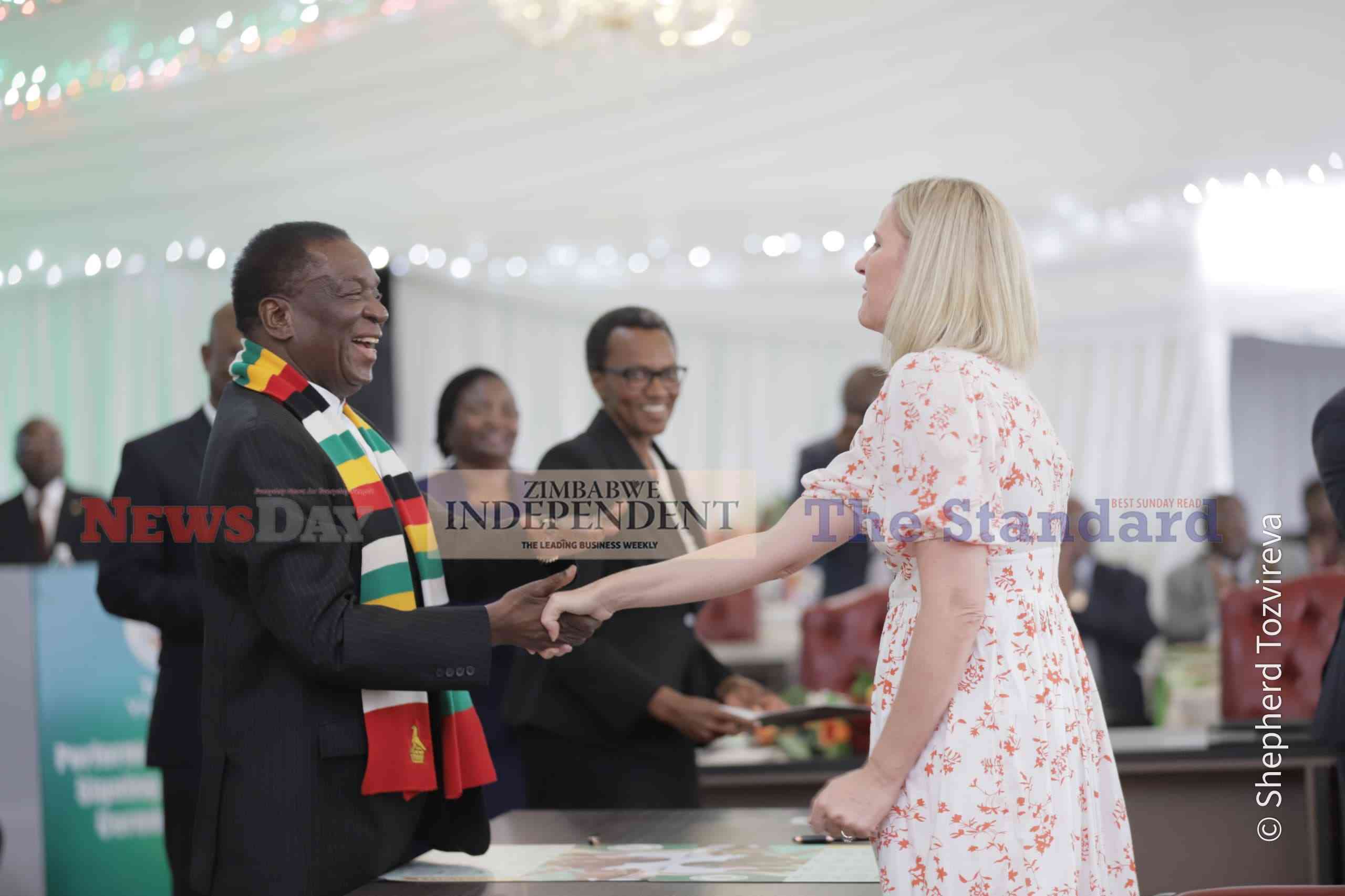 President Emmerson Mnangagwa congratulates Sports Minister Kirsty Coventry