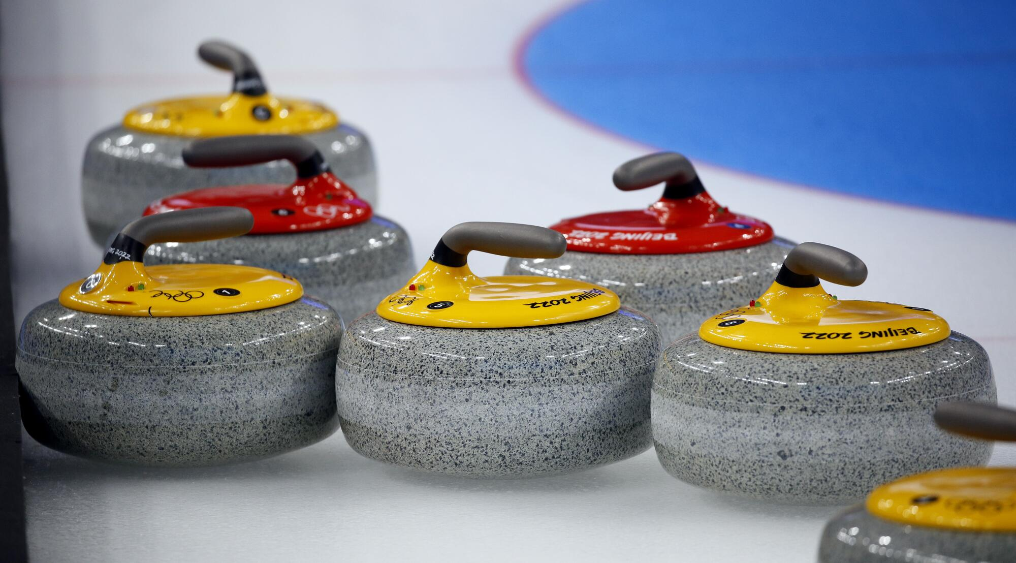 Why does a curling team choose “heavy” or ‘light’ stones?