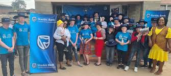Stanbic Bank presents US$30K goods to albino organisation