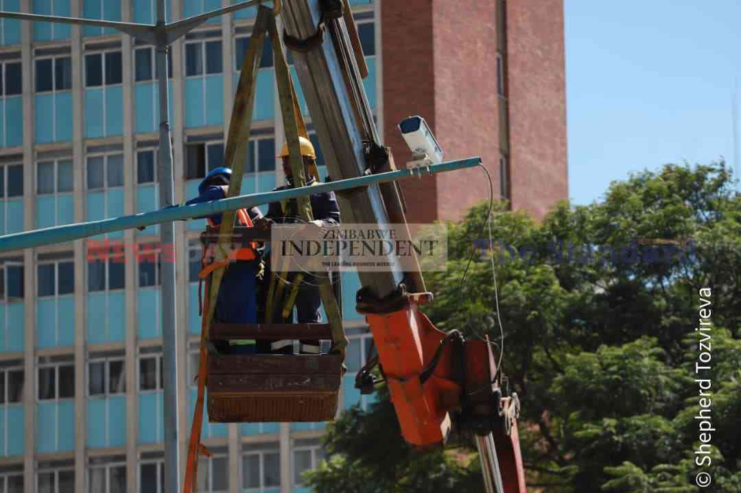 Contractors installing CCTV cameras