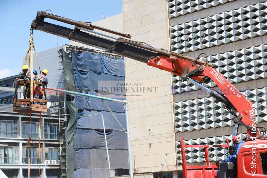 Contractors installing CCTV cameras