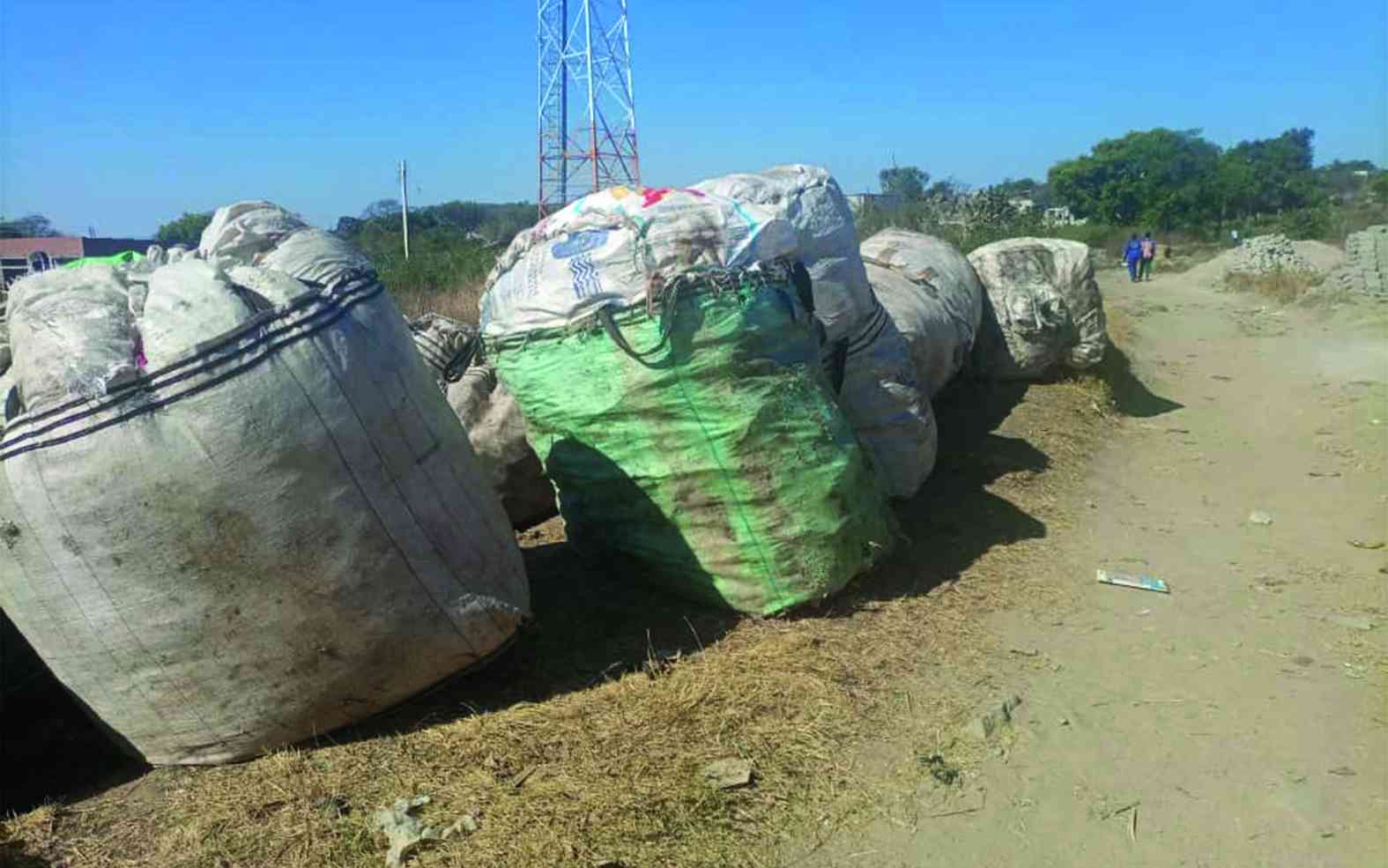 Woman turns town’s trash into a future for her children