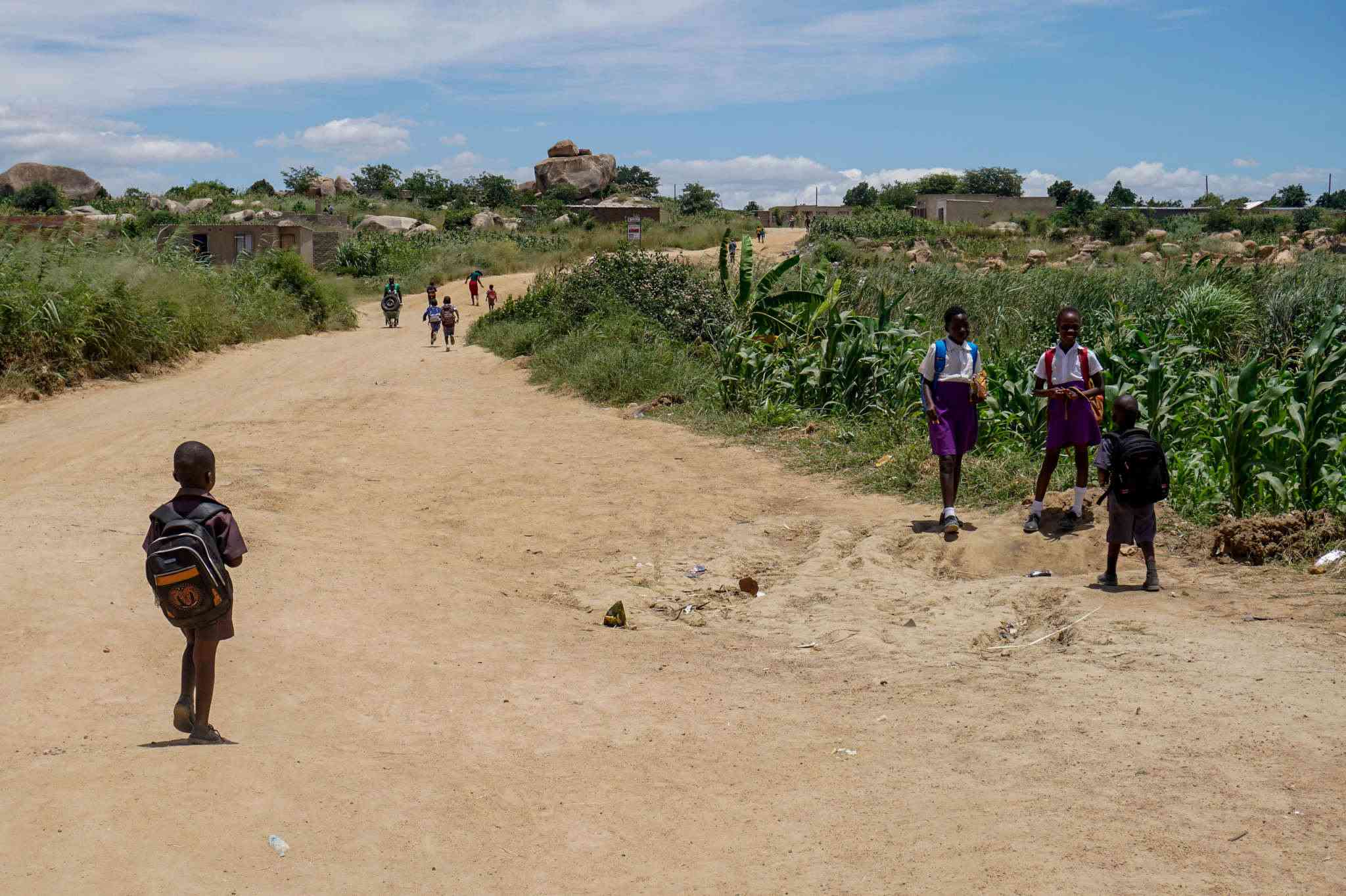 Children walk home after school in Mugarisanwa, an informal neighborhood in Harare. Roughly one-third of Harare’s residents now live in informal settlements, many of which lack basic services. Photo credit: Linda Mujuru, GPJ Zimbabwe