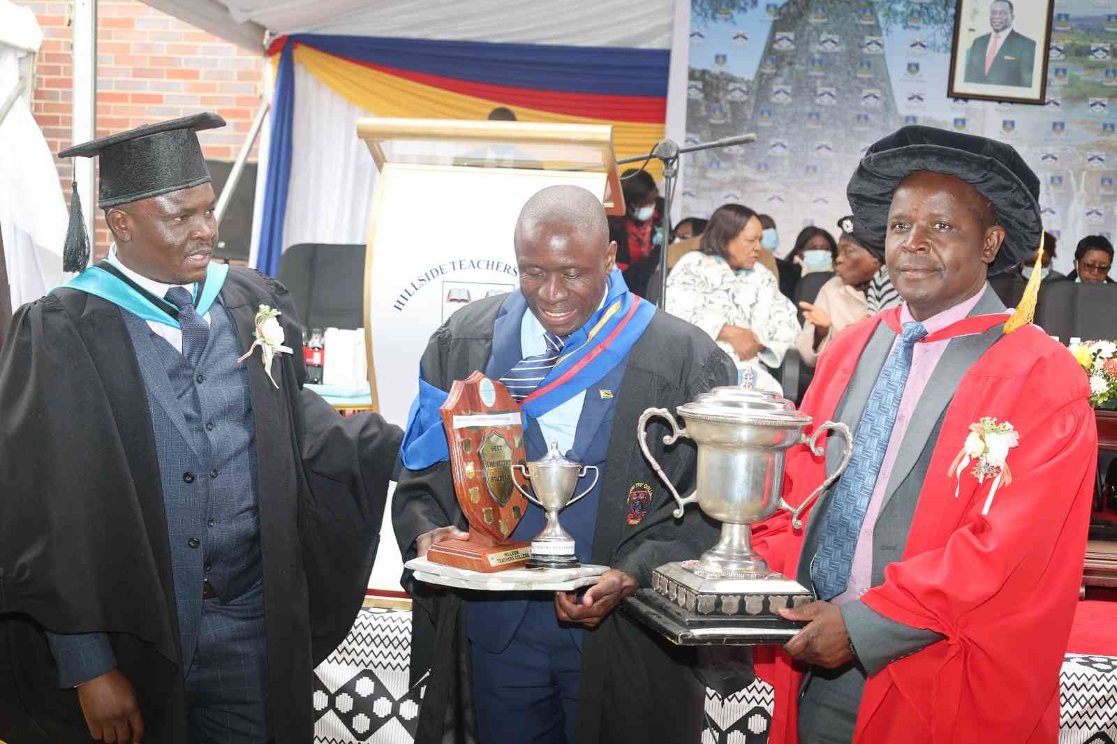 A TRIUMPH FOR SCIENCE EDUCATION: Ministry of Higher and Tertiary Education, Innovation, Science and Technology Development Deputy Minister Hon. Simelisizwe Sibanda and Professor Chabata from the University of Zimbabwe (right) share a proud moment with 41-year-old Munyaradzi Zingwe, who scooped the Overall Best Student award in the Secondary Education Science Diploma teacher training programme during the institution's graduation ceremony in Bulawayo - Picture: MHTEISTD Communications and Advocacy Officer Kudakwashe Hunda